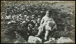 Image of Polar Eskimo [Inughuit] Child with Puppies